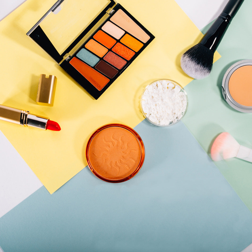makeup materials on a multi colored background